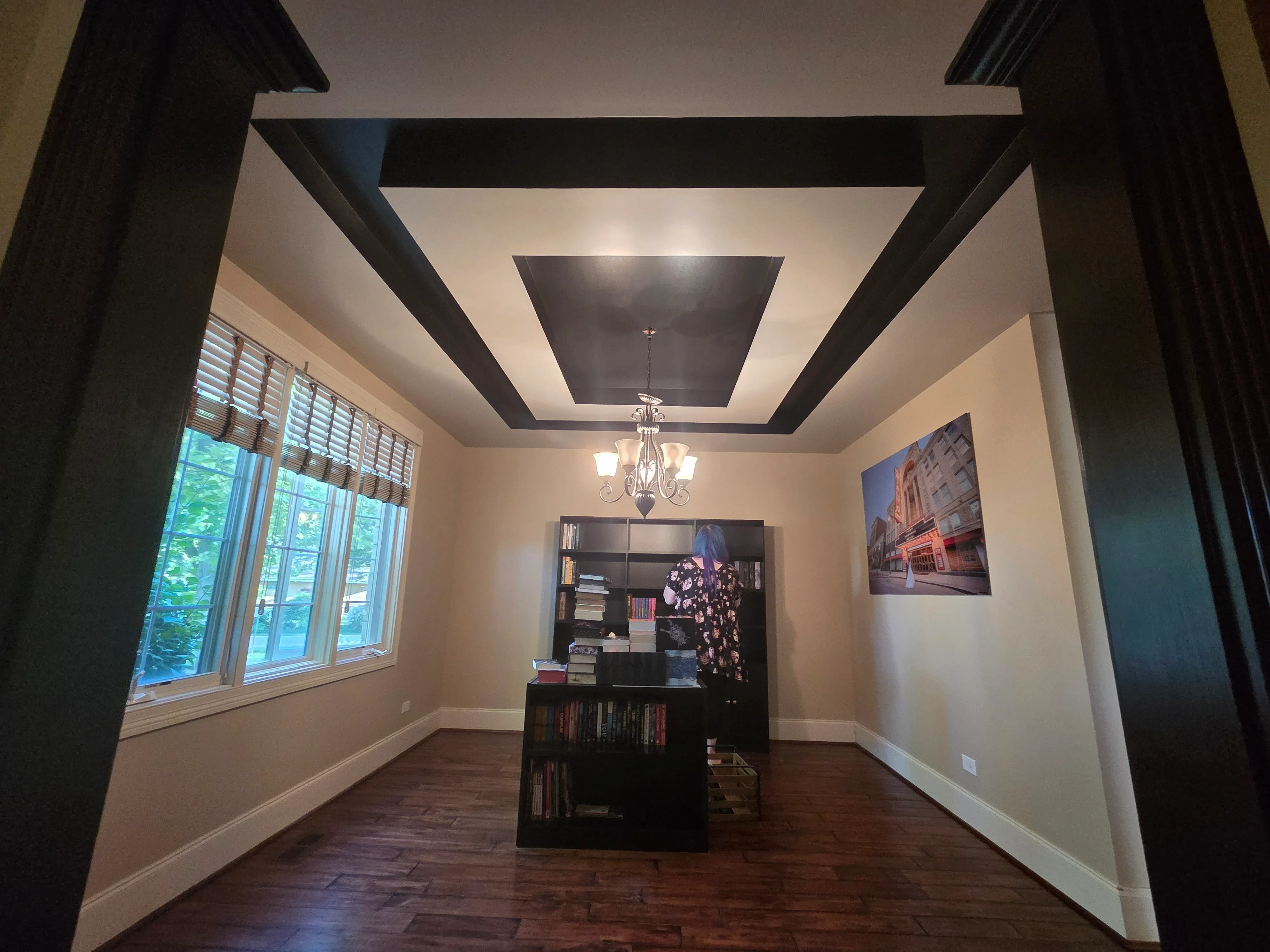 Coffered ceiling with dark beams and cream panels, cream walls, dark wood floor, professional interior painting