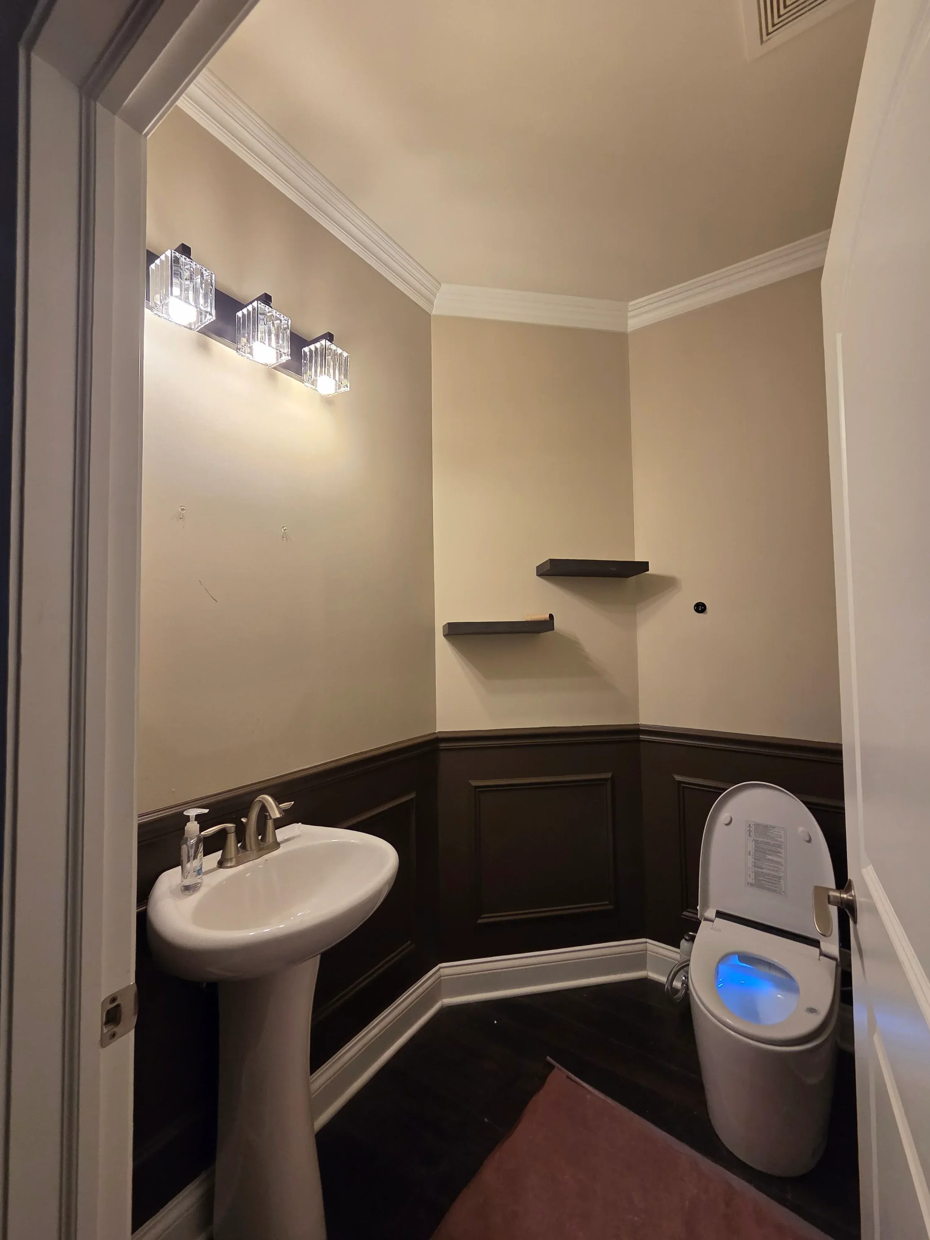 Finished drywall walls with paint, crown molding, and recessed lighting in residential room