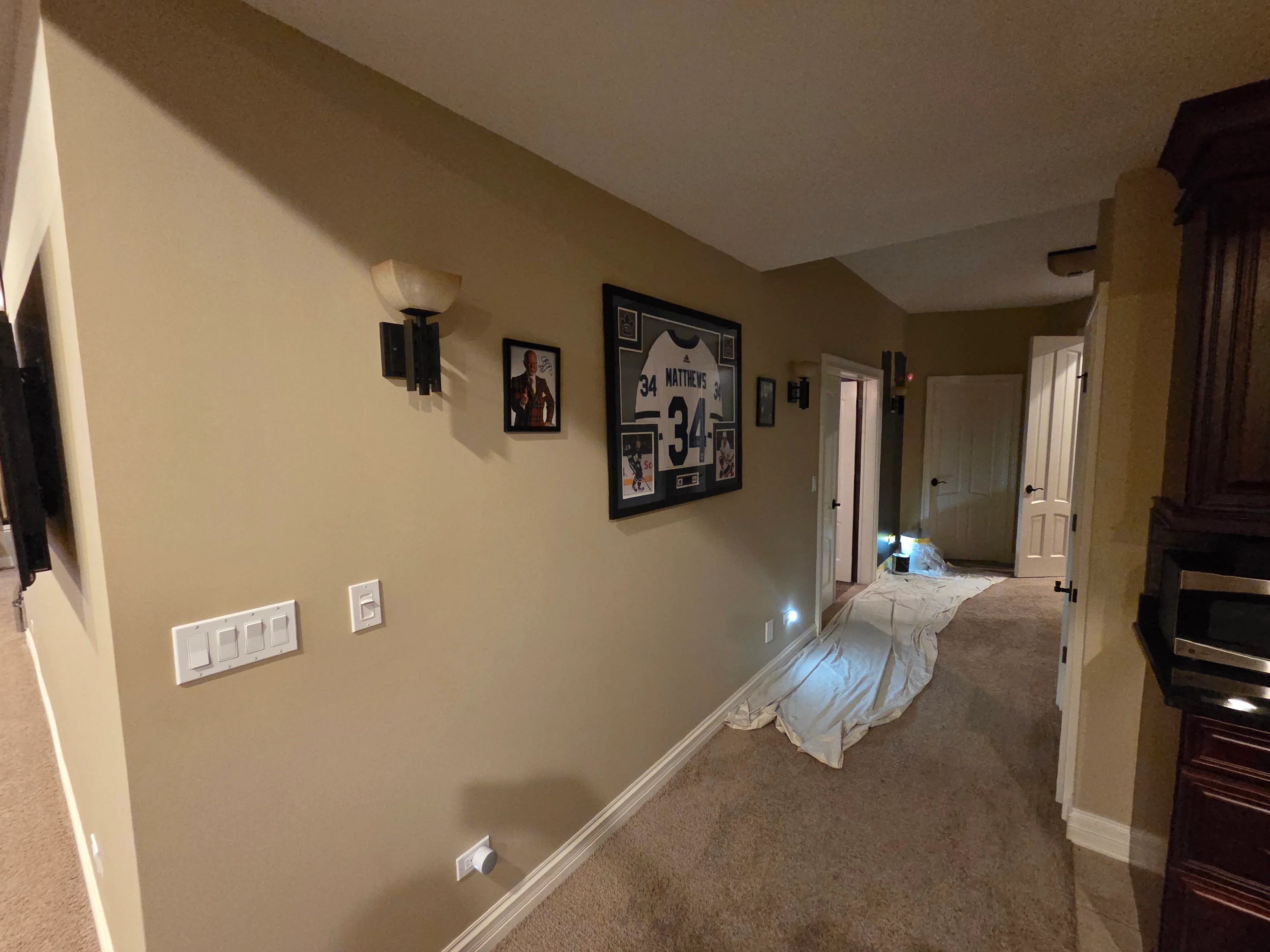 Freshly painted bedroom with neutral walls, white trim, and new electrical outlets